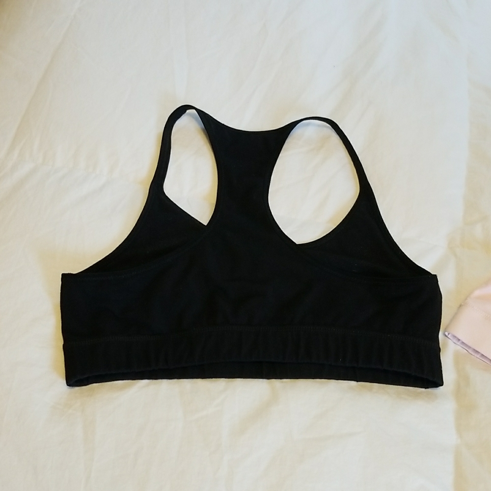 2 Pact Organic Cotton racer back bras, one light Pink, one Blk
